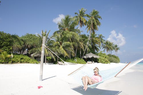 Woman Lying on Hammock in Seashore