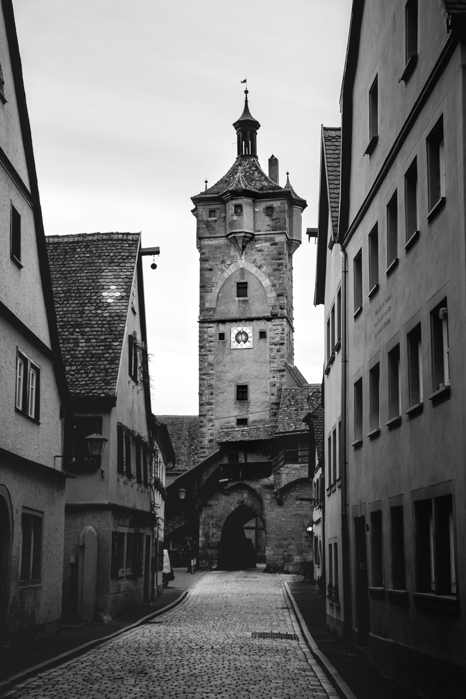 Half-timbered medieval town on the Romantic Road day trip from Munich, golden light on the old gate.