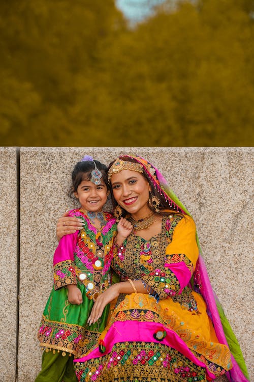 A woman and her daughter in traditional clothing