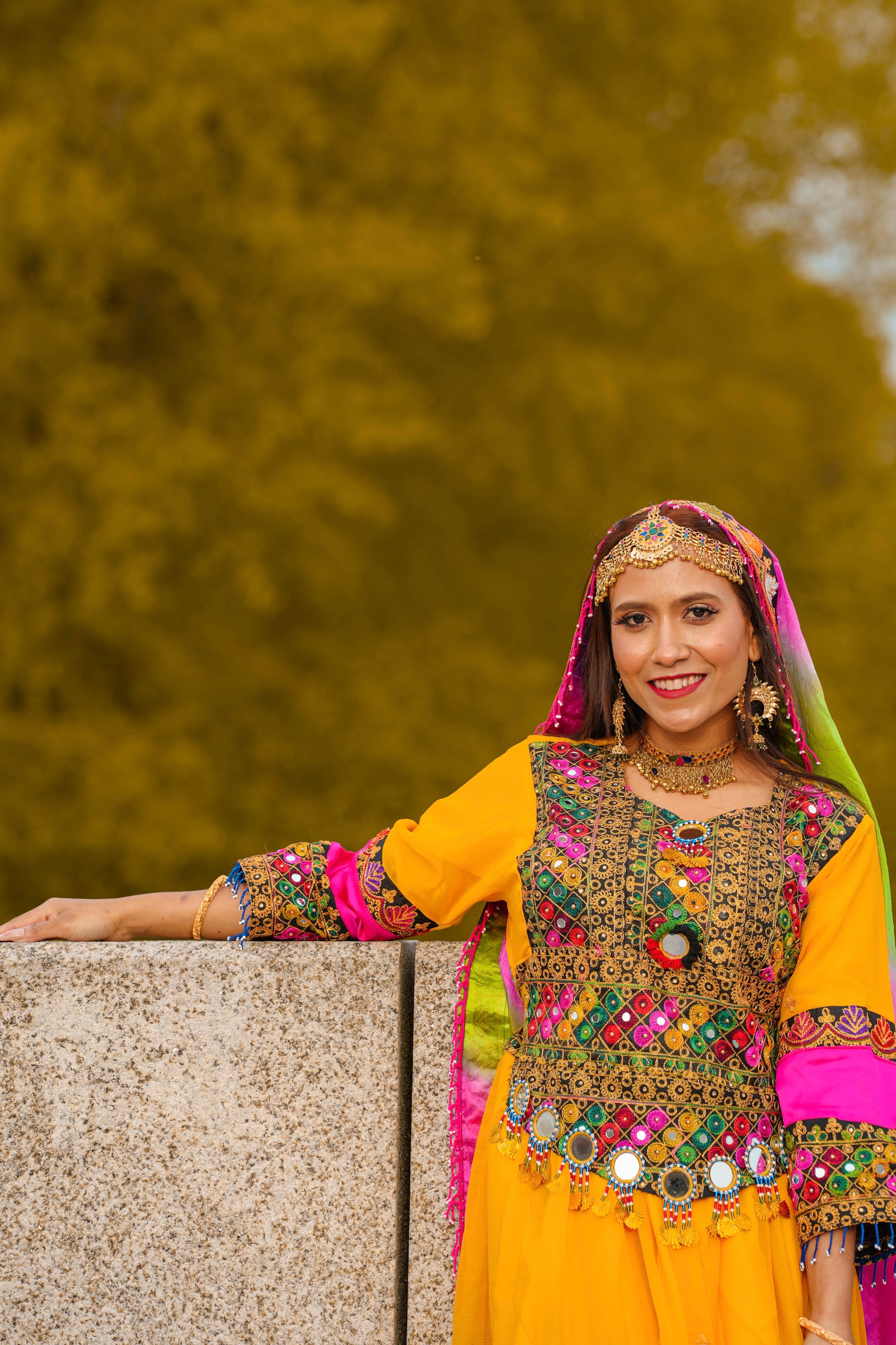 Smiling Woman in Traditional Clothing · Free Stock Photo