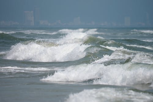 Ocean waves crash onto the beach of Da Nang (Central Vietnam)