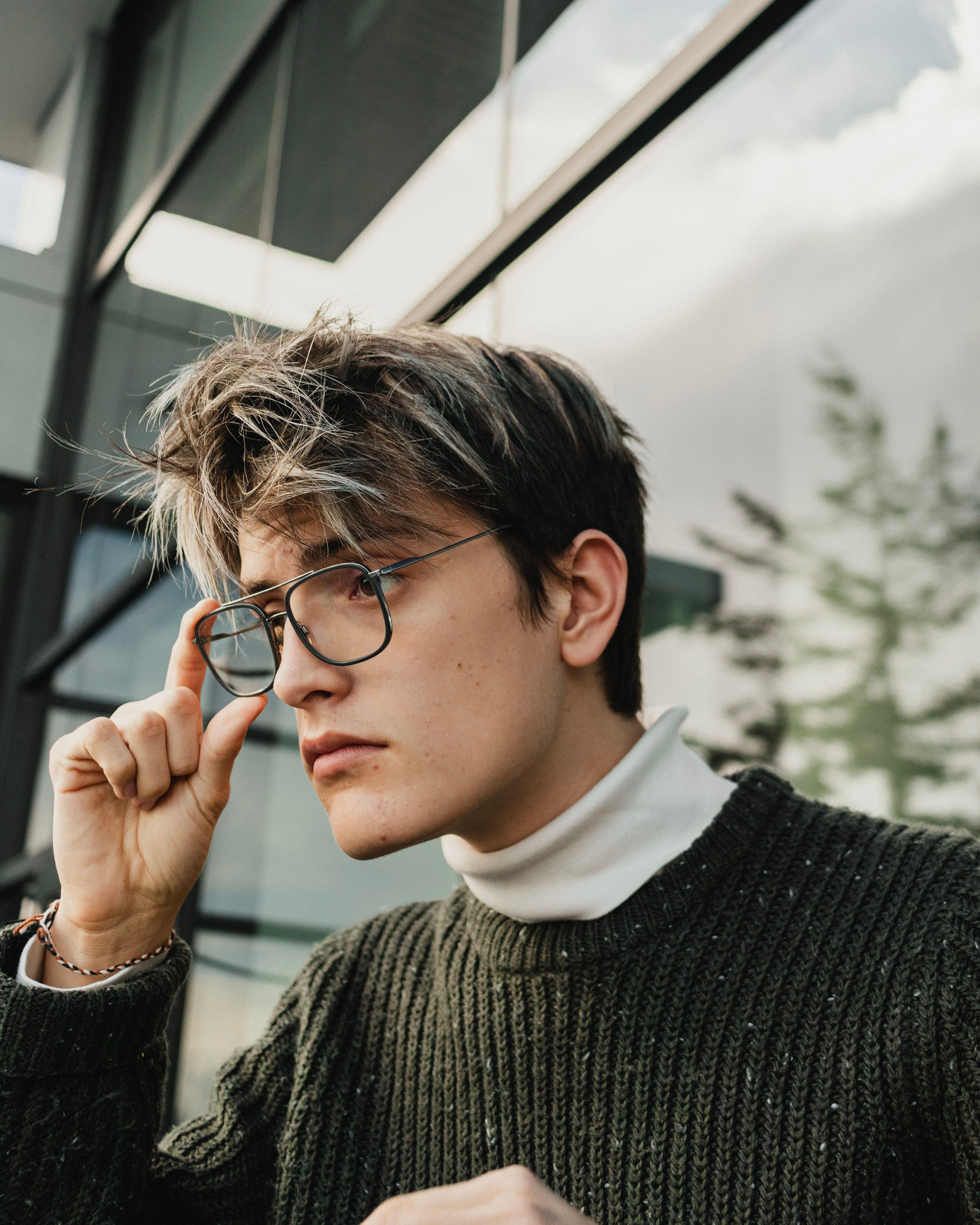 Portrait of Man with Eyeglasses on a Bus Stop · Free Stock Photo