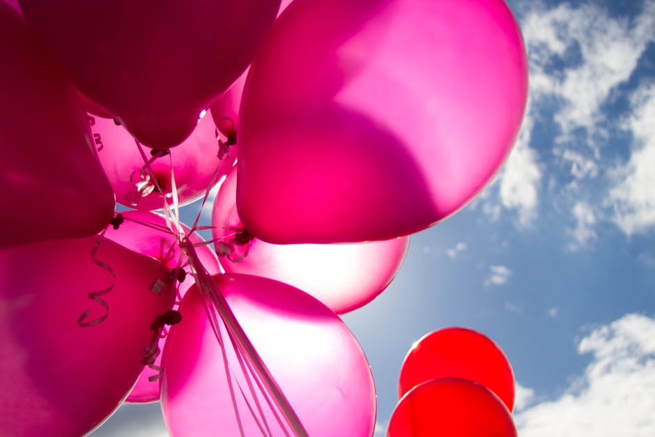 Pink and Red Balloons during Daytime