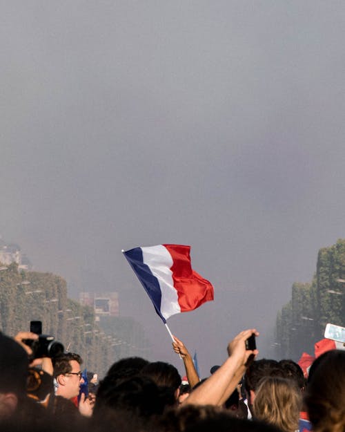 Free  Raising the Blue, Red, and White Flag Stock Photo