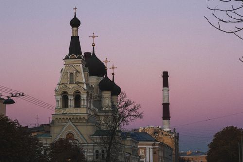 Free Beautiful church skyline at sunset in Saint Petersburg, Russia, showcasing stunning architecture and pastel skies. Stock Photo