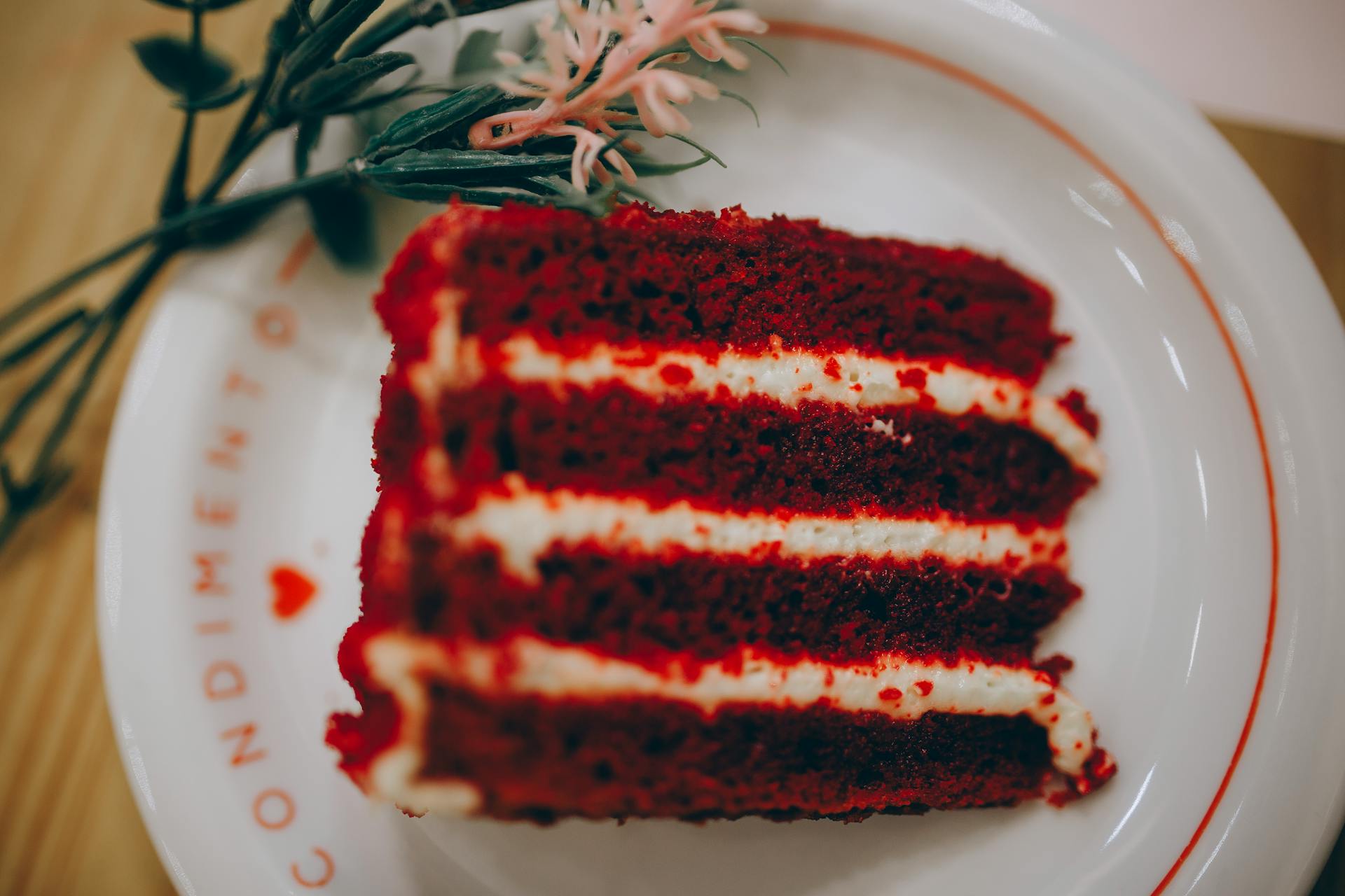 Close-up of a vibrant red velvet cake slice, perfect for dessert lovers.