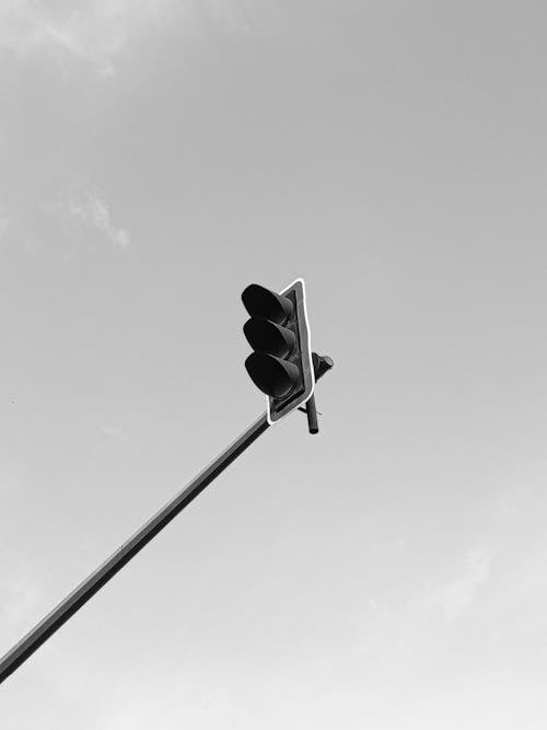 A black and white photo of a traffic light