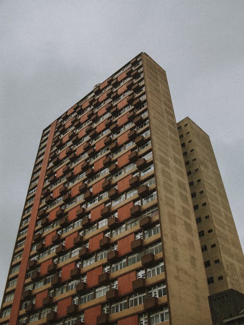 A tall building with many windows and balconies