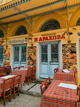 Authentic Greek restaurant outdoor seating with classic architecture in Athens.