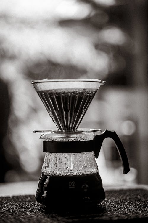 A black and white photo of a coffee maker