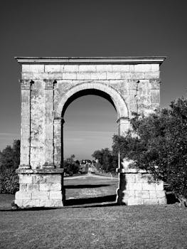 Stunning black and white photograph of the ancient Arc de Berà in Roda de Bará, Catalonia.