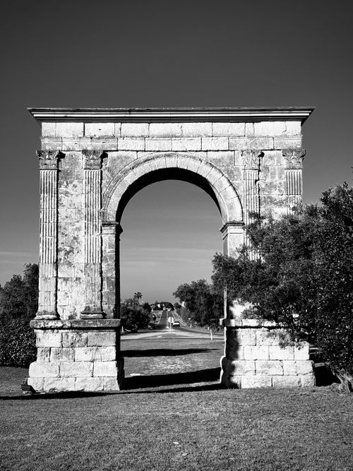 Free Stunning black and white photograph of the ancient Arc de Berà in Roda de Bará, Catalonia. Stock Photo