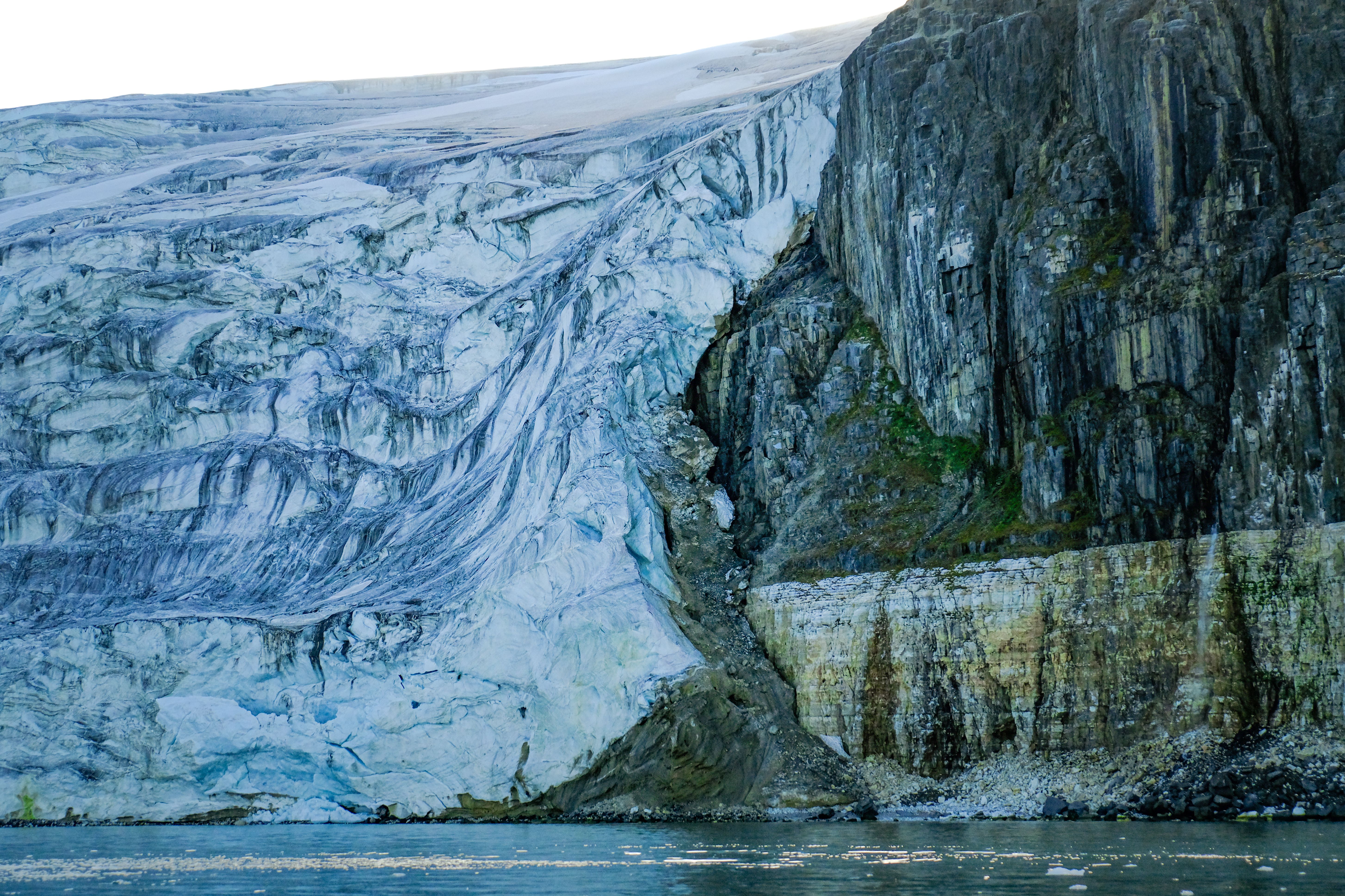 Glacier Slipping on Rock into Sea · Free Stock Photo