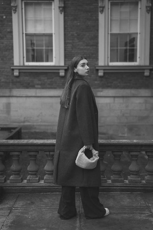 Woman Wearing Coat on a Street in Black and White 
