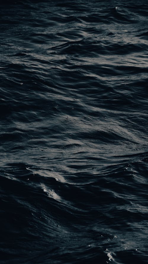 An ocean with waves and dark water