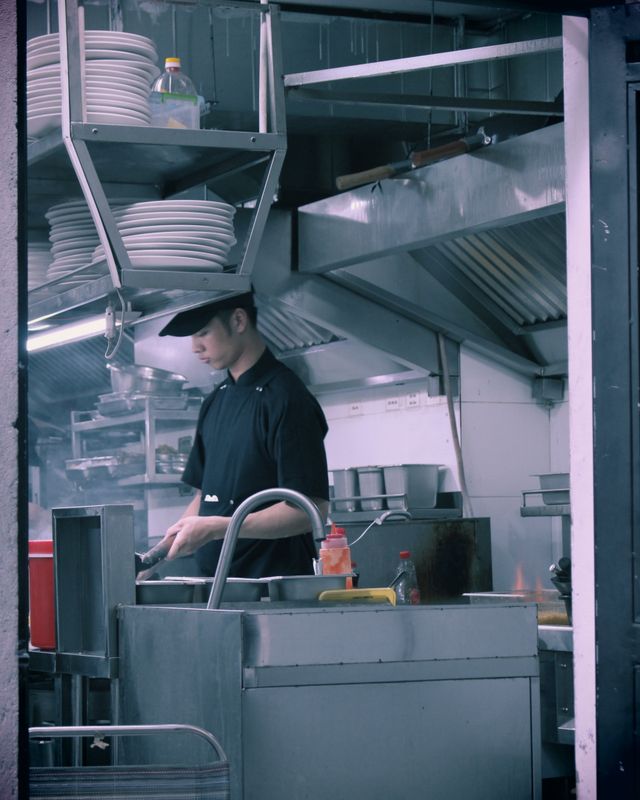 Chef preparing food in a modern restaurant kitchen