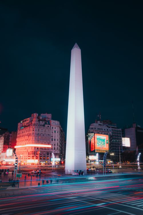 Free Stunning view of the illuminated Obelisk of Buenos Aires at night with vibrant city lights. Stock Photo