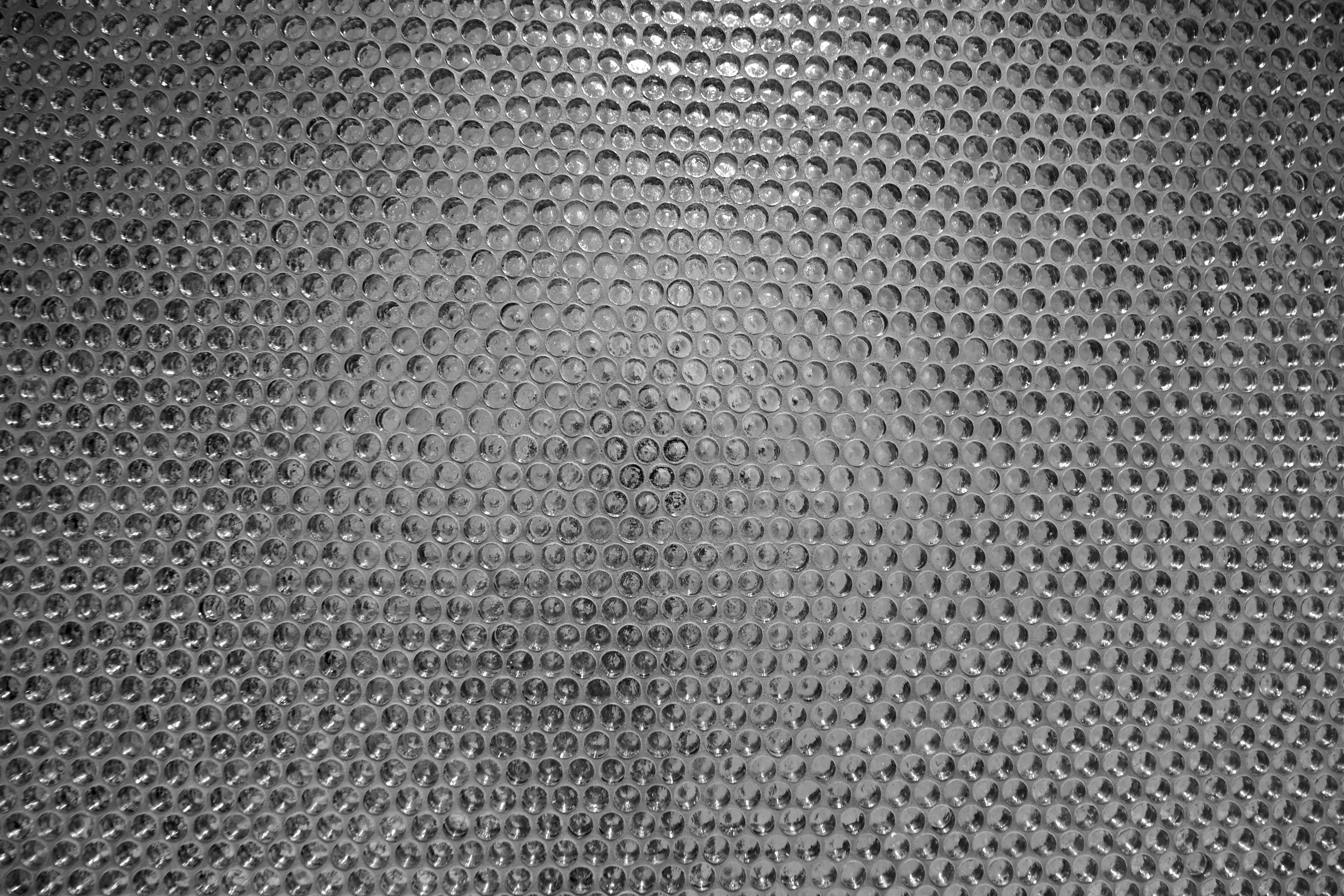 A black and white photo of a metal mesh · Free Stock Photo