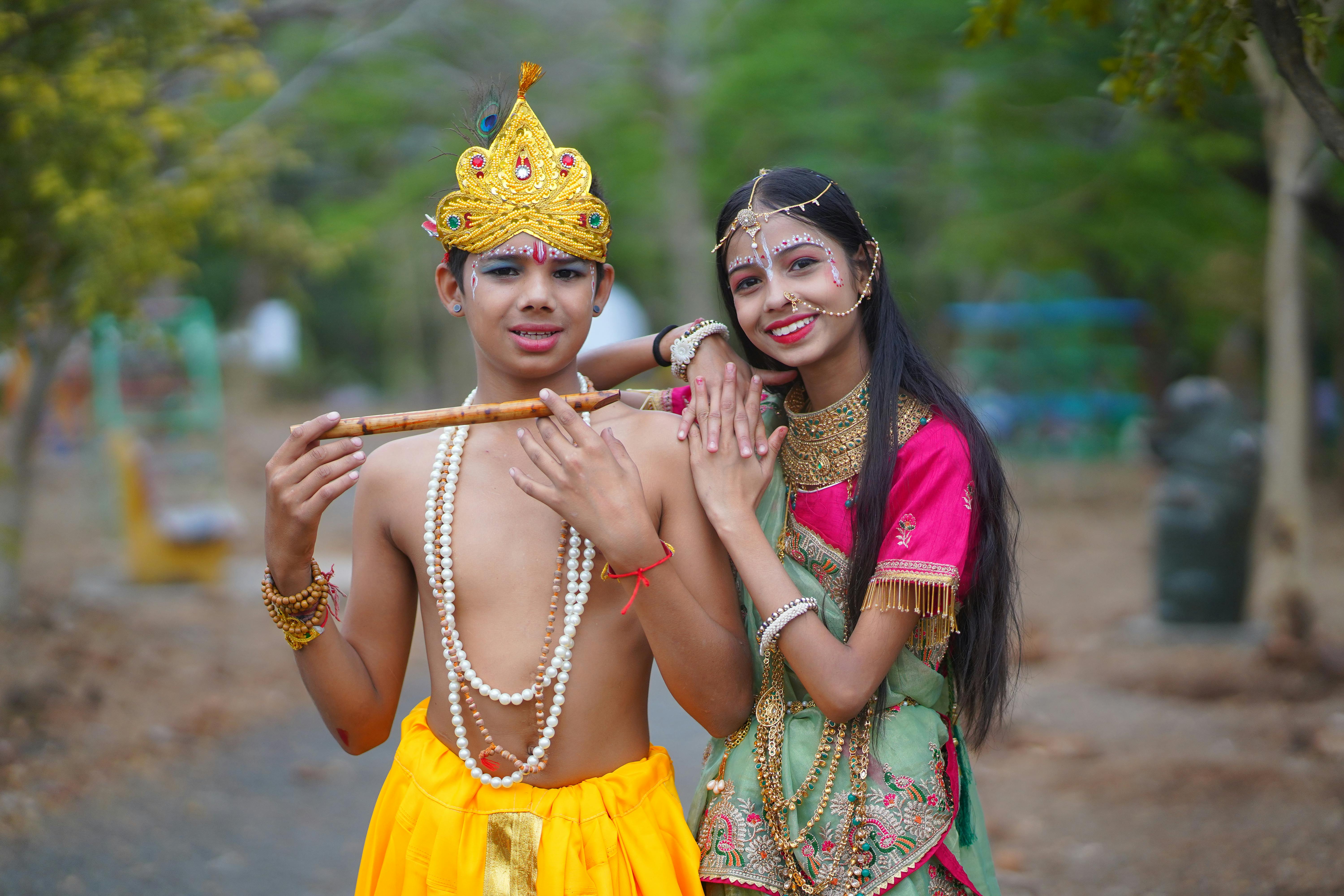 Children dressed as Lord Krishna and Radha highlighting cultural festivities.