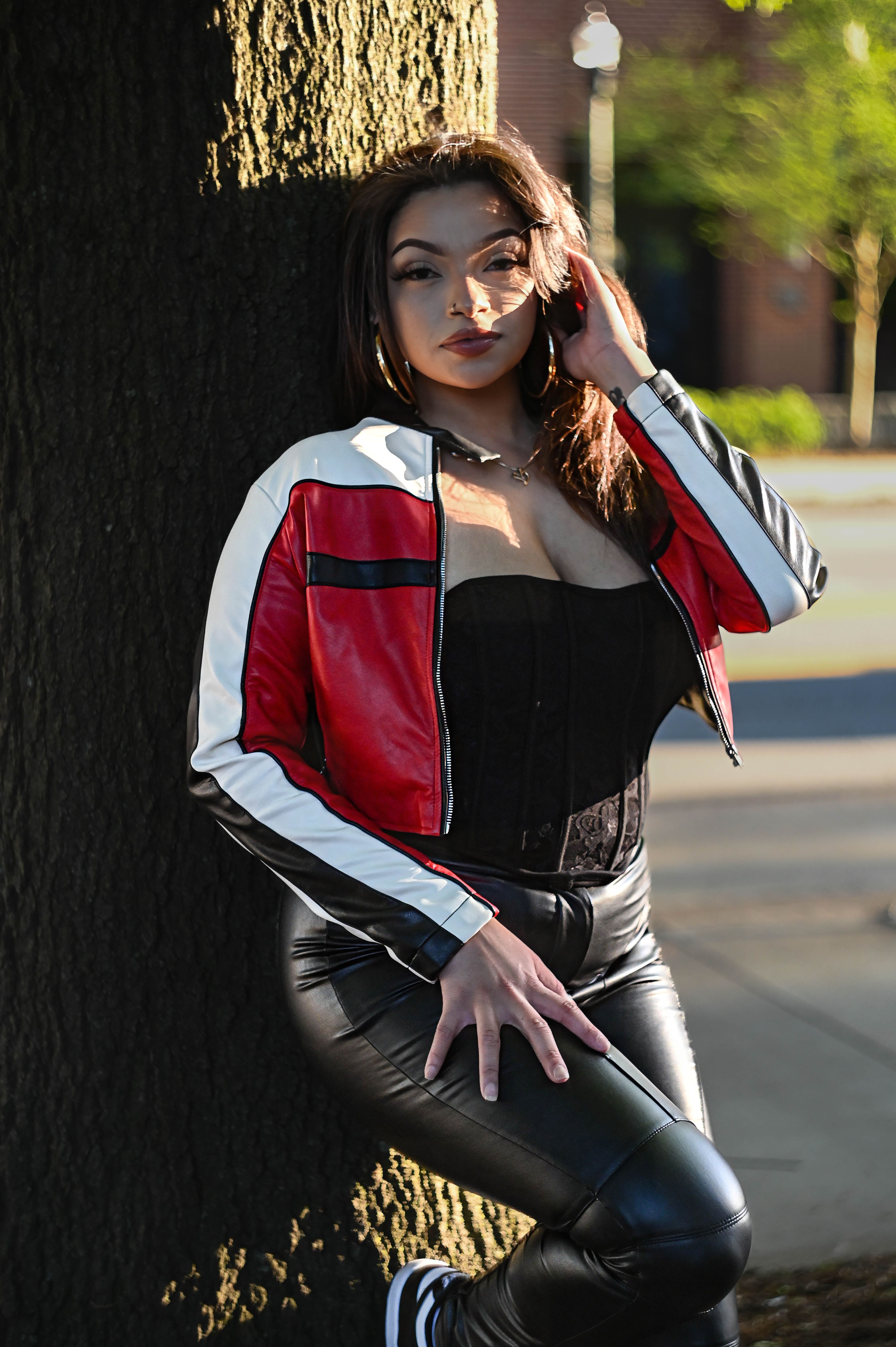 Portrait of Woman Posing in Leather Jacket · Free Stock Photo