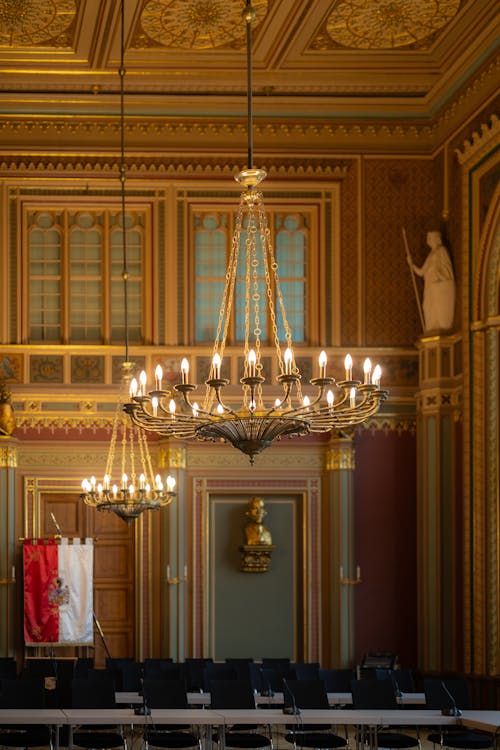 A chandelier hanging from the ceiling in a large room