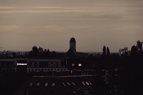 A clock tower is in the distance