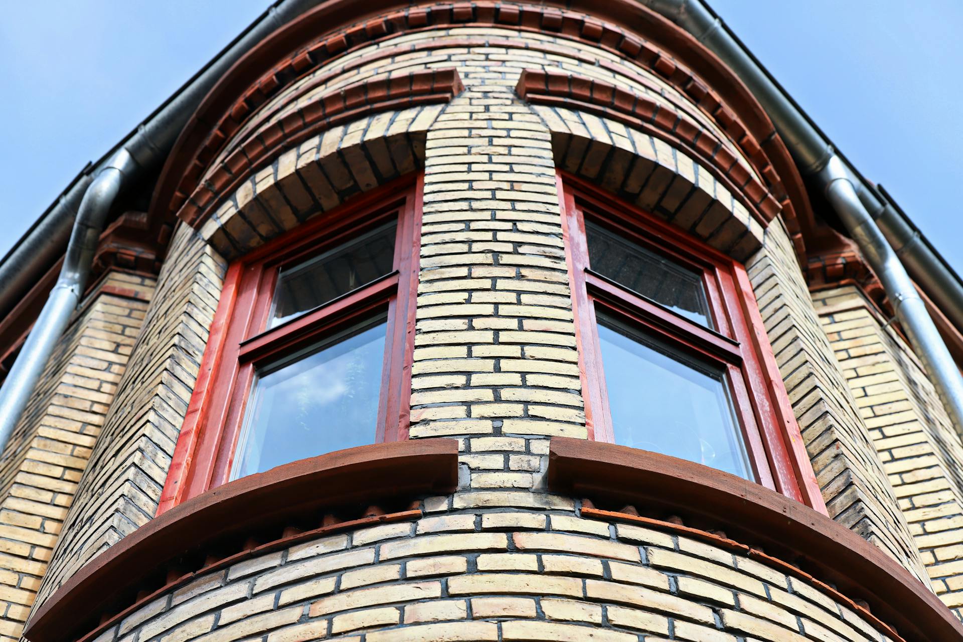 Windows in the Rounded Corner of a Brick Building