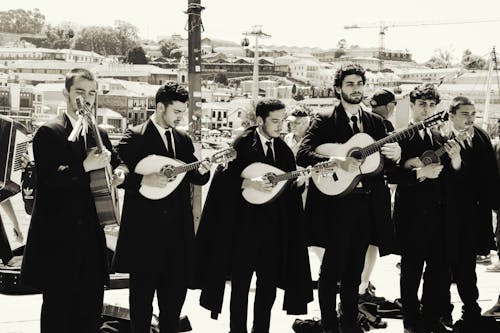 A group of men in suits and ties playing instruments