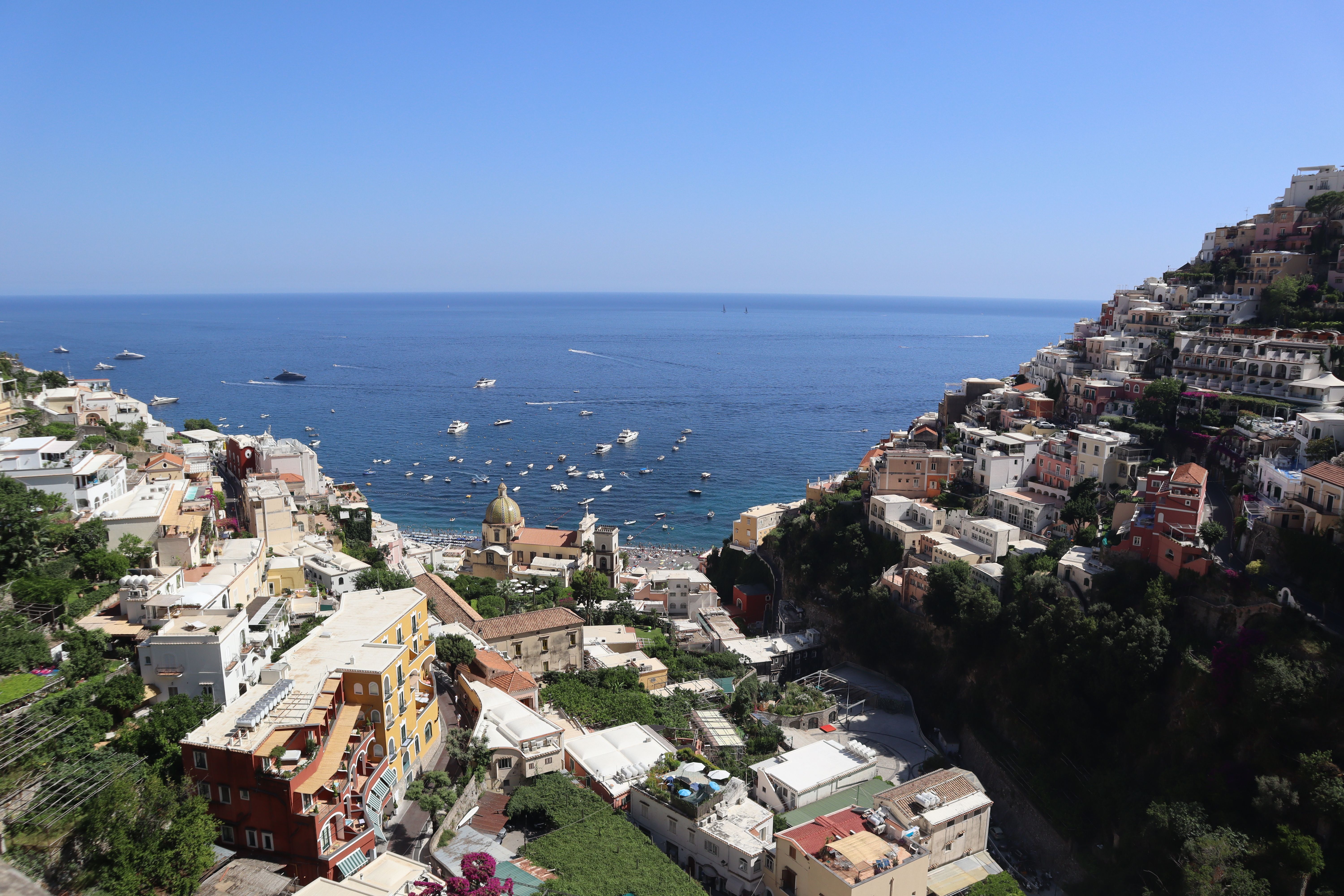 High view over Positano's rooftops toward open sea