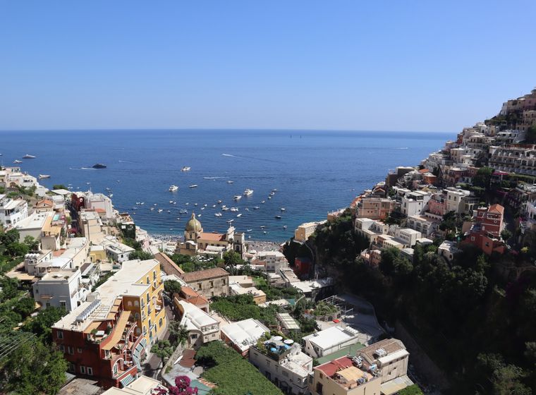 High view over Positano's rooftops toward open sea