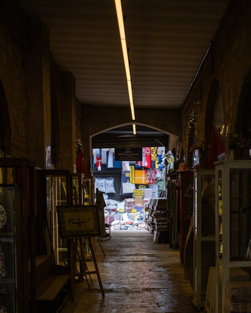 A narrow alley with lots of items on display