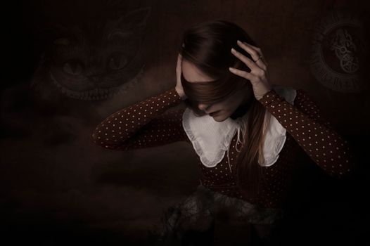 A woman in a vintage dress poses in a dark, mysterious setting with fantasy elements.