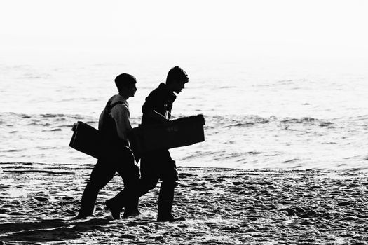 Couple Walking on Beach in Black and White