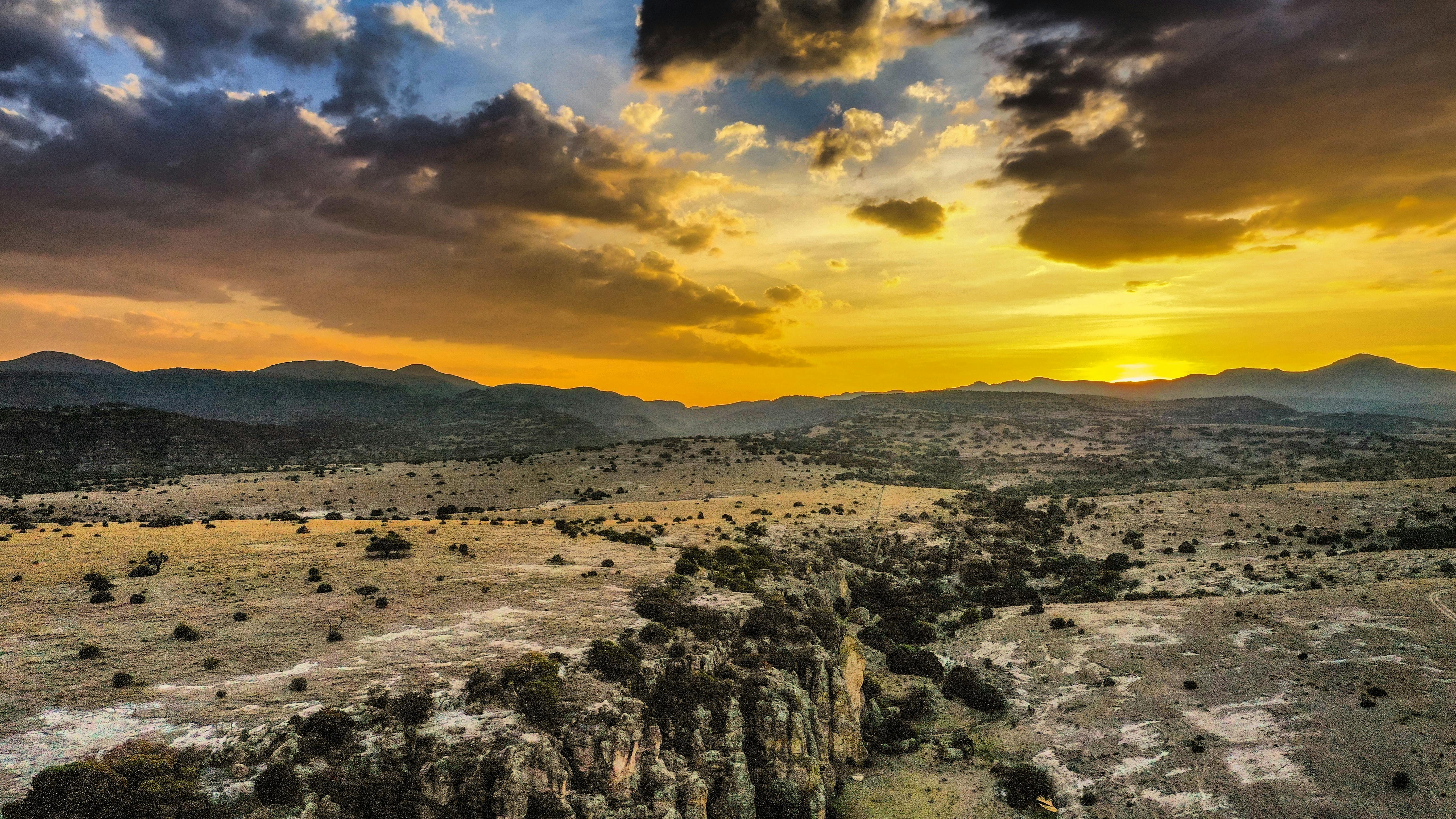Breathtaking sunset over the rugged desert landscape of La Congoja, highlighting dramatic skies and vast horizons.