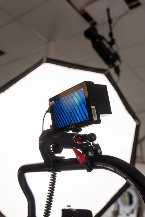 A camera mounted on a tripod with a light