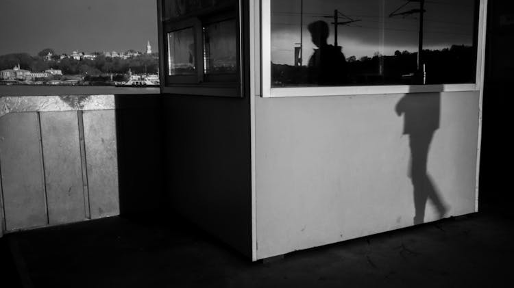 Shadow Of Person Walking Near Booth In Istanbul