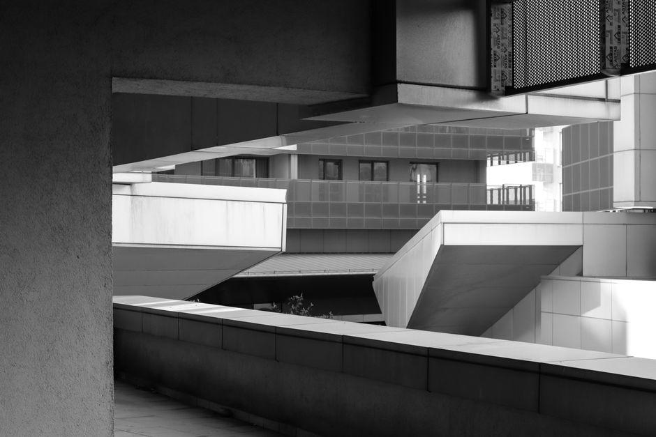 Black and white image showcasing modern architectural elements in an urban setting.