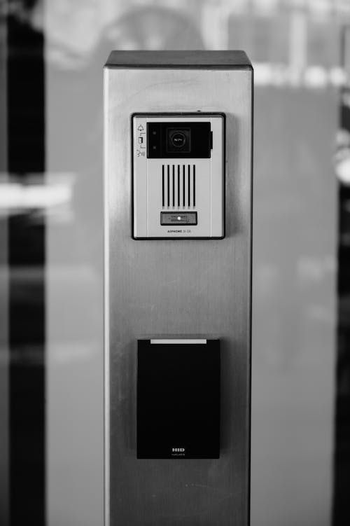 A black and white photo of a metal door