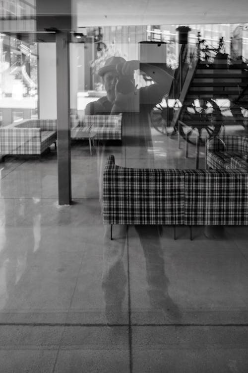 A black and white photo of a person sitting in a chair