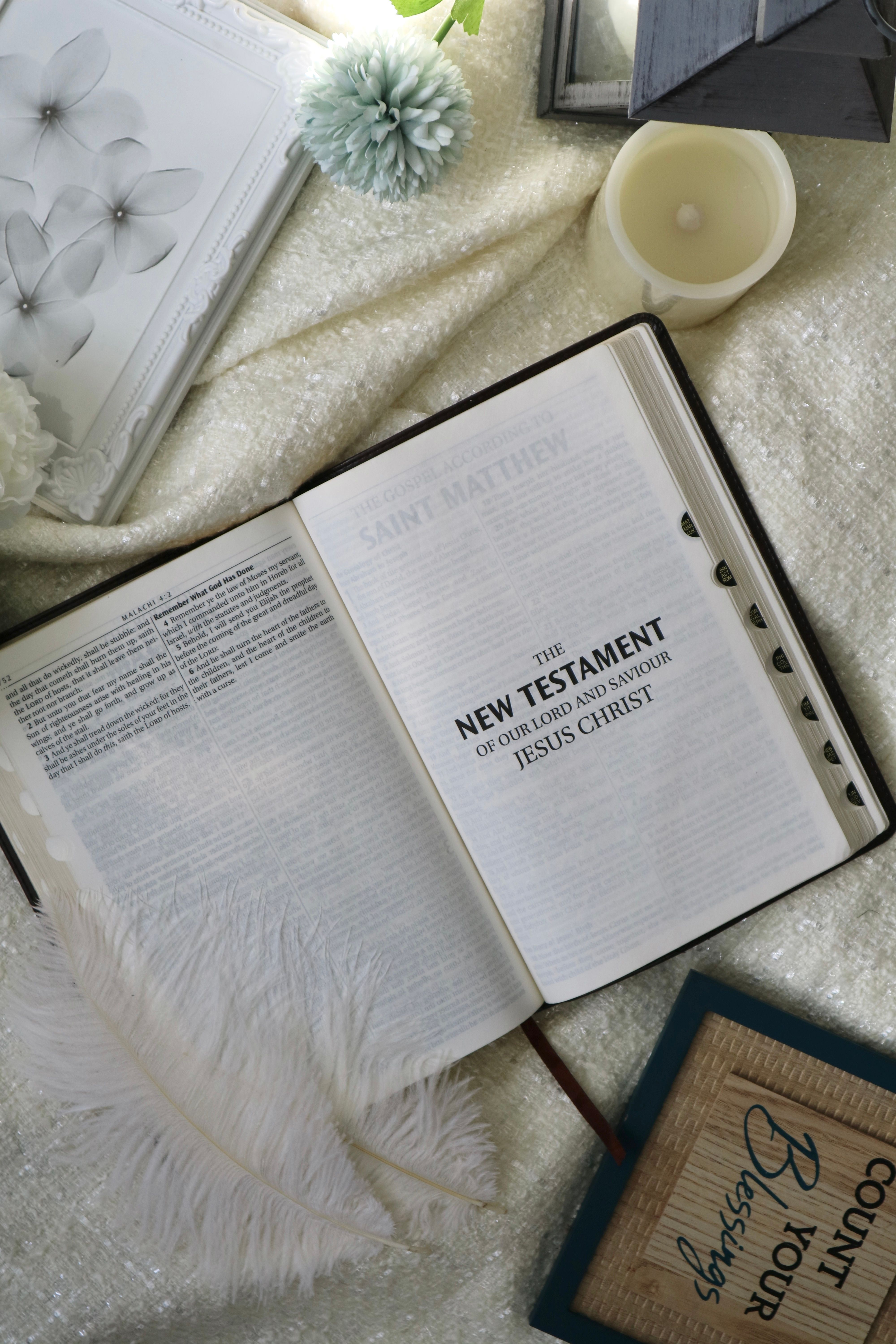 A serene top-down view of an open Bible with decor elements conveying faith and tranquility.