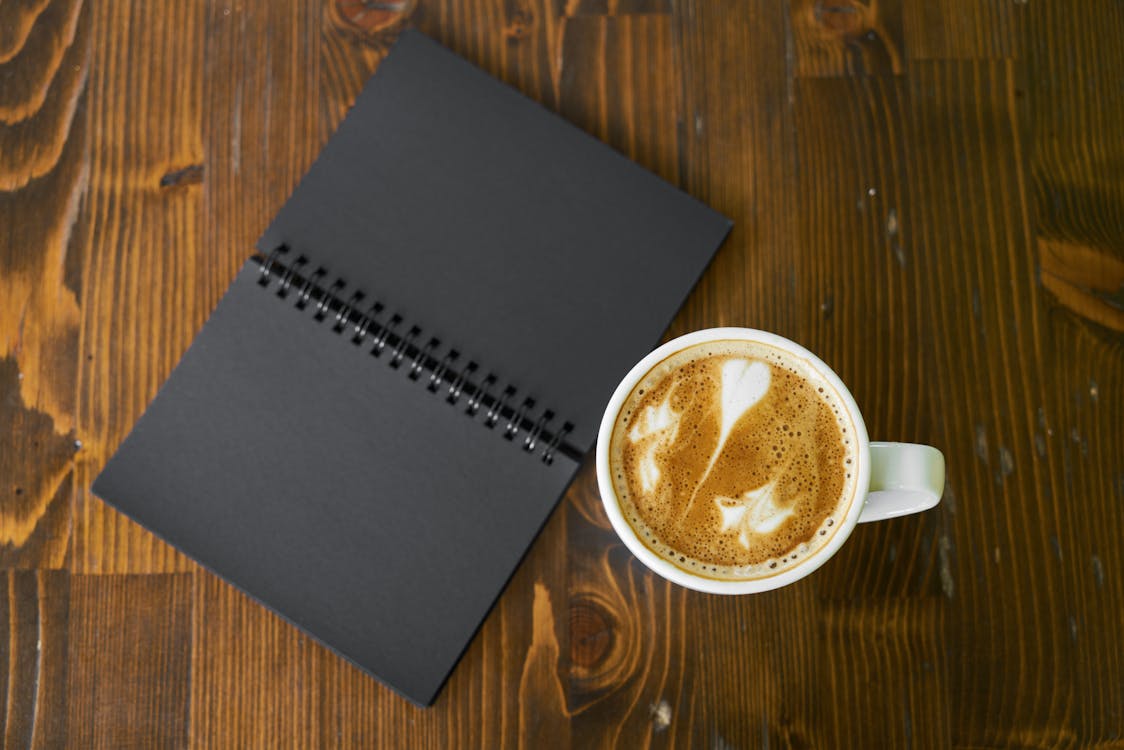 Free White Ceramic Mug on Brown Surface Stock Photo