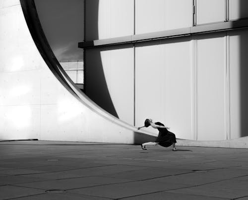 A skateboarder is riding down a ramp