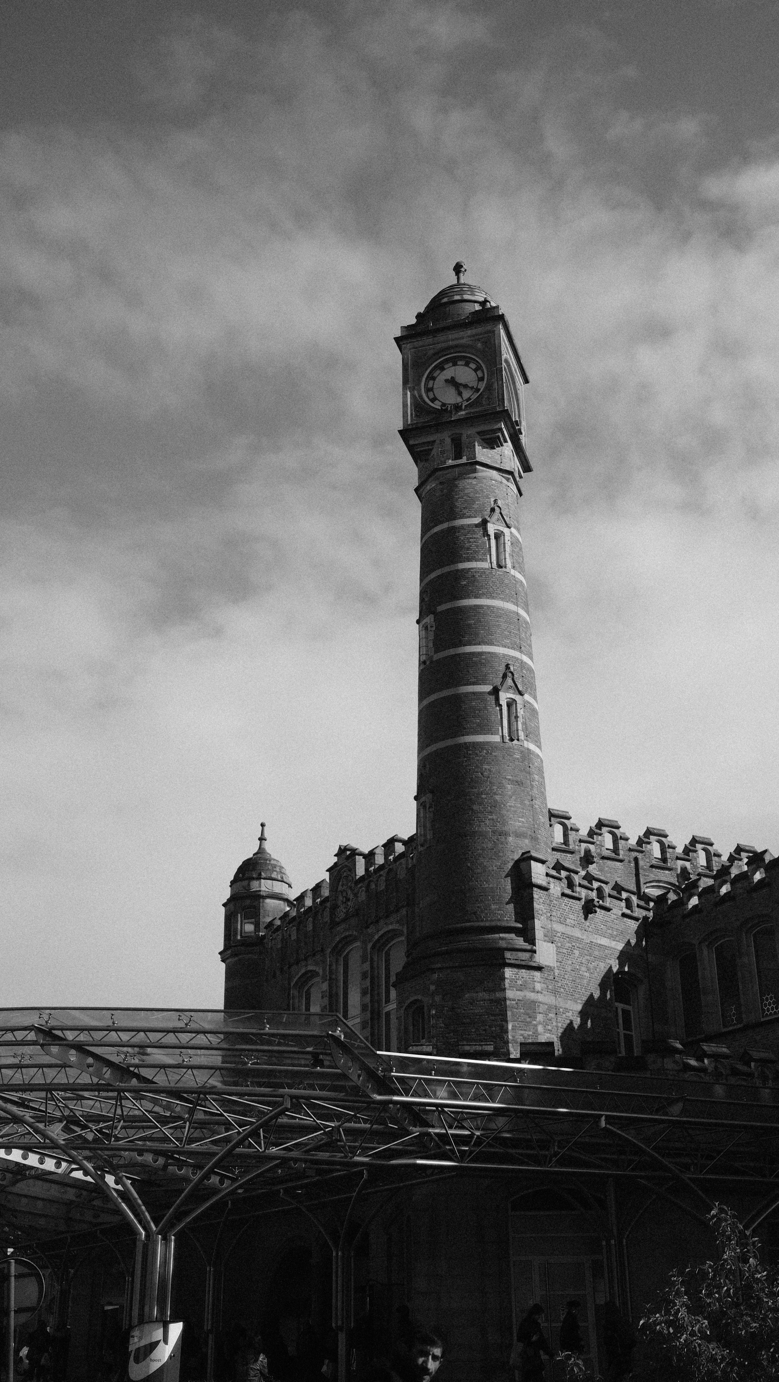 A black and white photo of a clock tower · Free Stock Photo