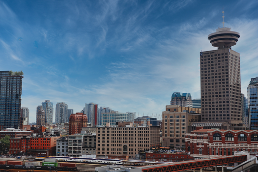 Captivating view of Vancouver's cityscape with prominent city landmarks including Harbour Centre.
