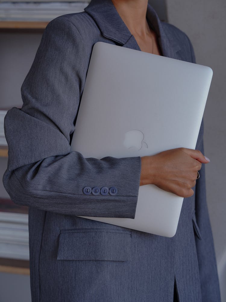 Elegant Woman Holding A Laptop 