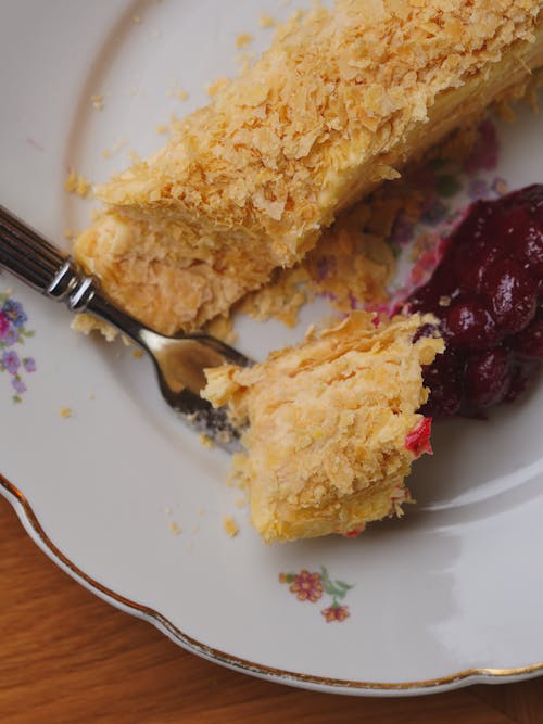 A piece of cake with a fork on a plate