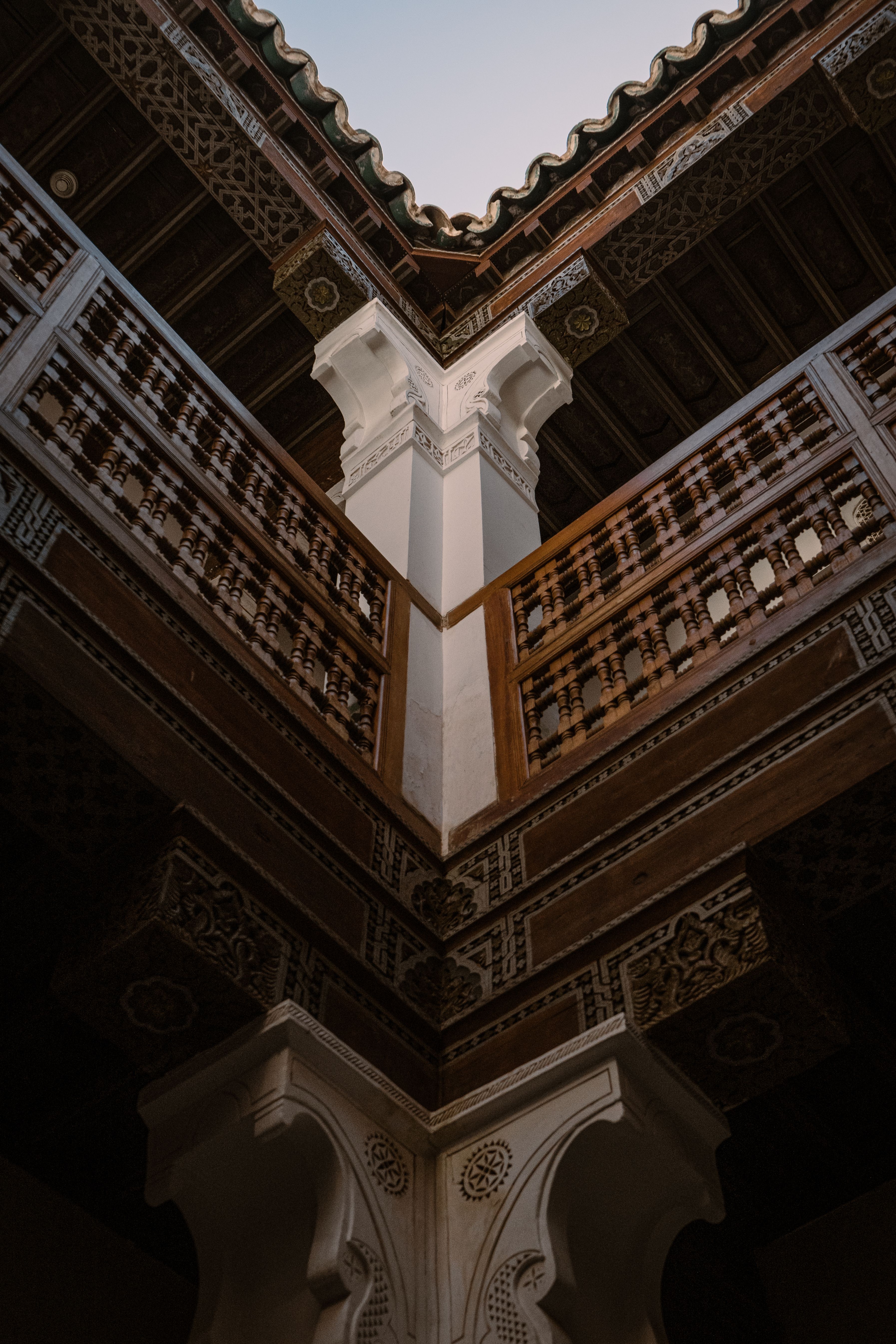Explore detailed architectural patterns in a landmark of Marrakesh, Morocco, captured from a low angle.