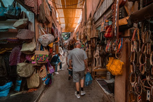 Explore the bustling souk in Marrakech with colorful textiles and local crafts on display.