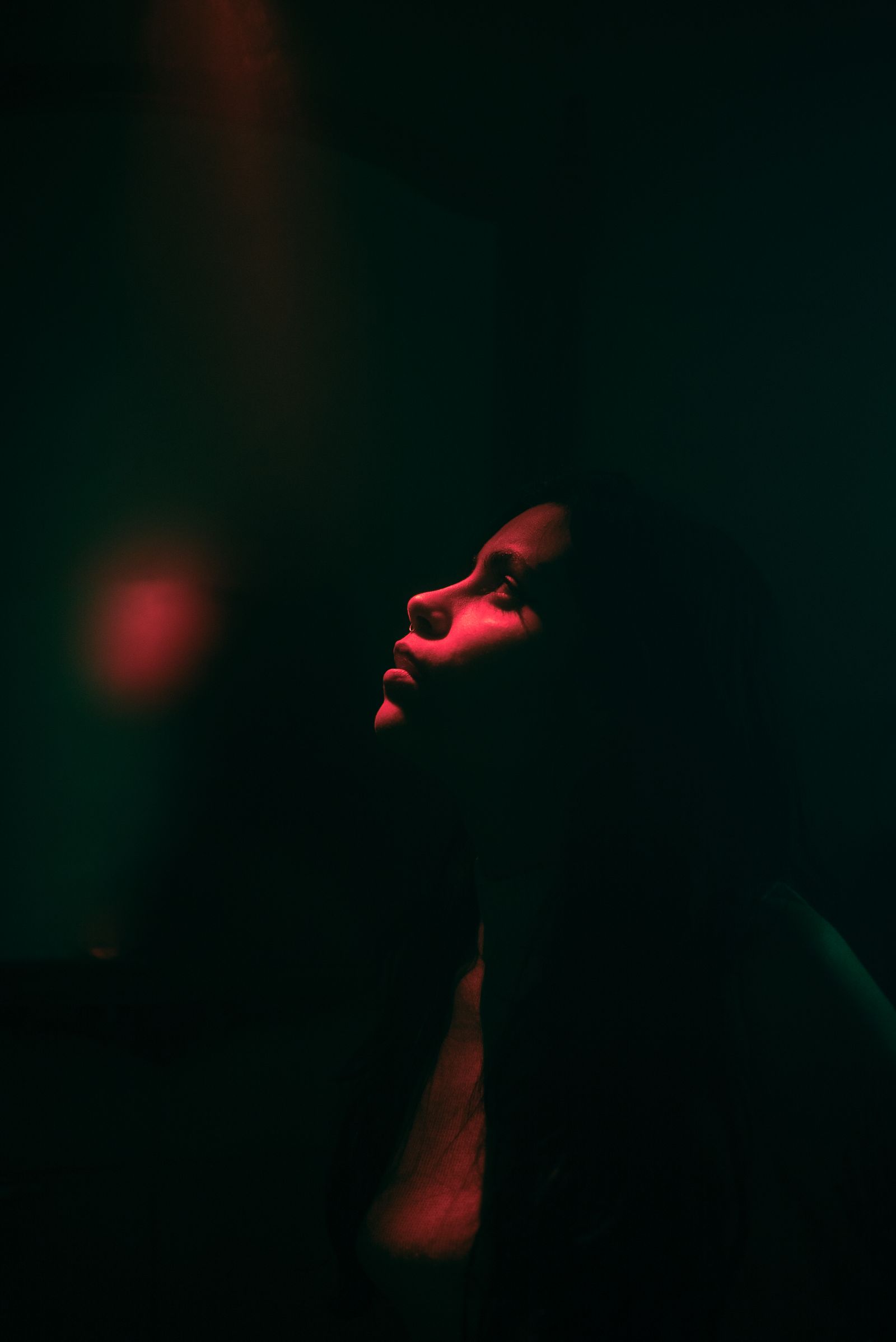 A Woman Standing in the Dark · Free Stock Photo