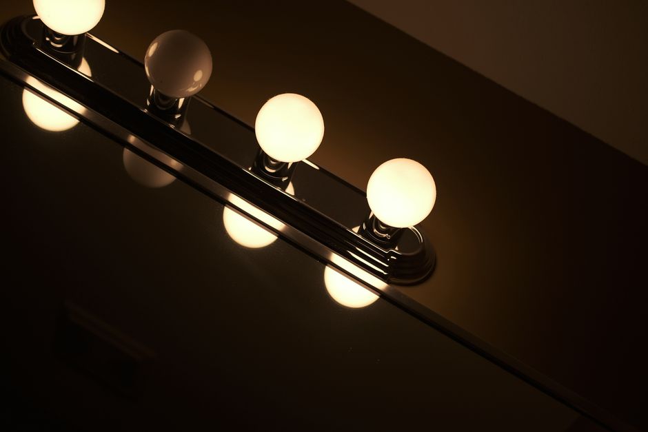Comparison of traditional vanity bulbs versus sleek modern LED strip lighting - led strip mirror lighting Comparison of traditional vanity bulbs versus sleek modern LED strip lighting - led strip mirror lighting